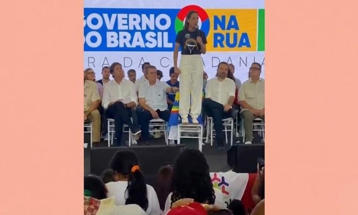 Raquel Lyra discursa de cima de uma cadeira: "“vão querer separar quem é branco, quem veste o preto, veste o roxo, amarelo, azul ou vermelho” (Foto: Frame de vídeo do @jc_pe/Reprodução)